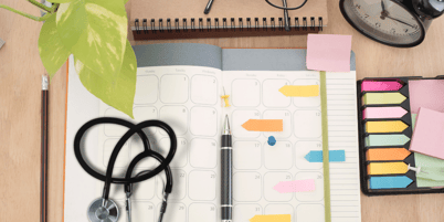 notebook and sticky notes on a desk